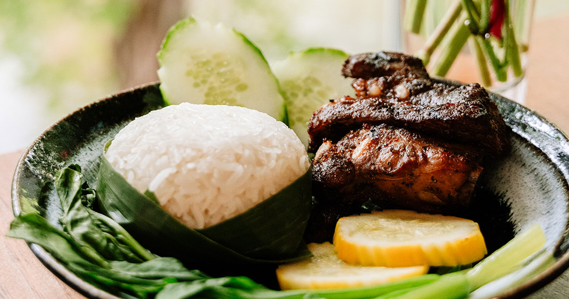 Dish of ribs and steamed rice at Dalaya Thai