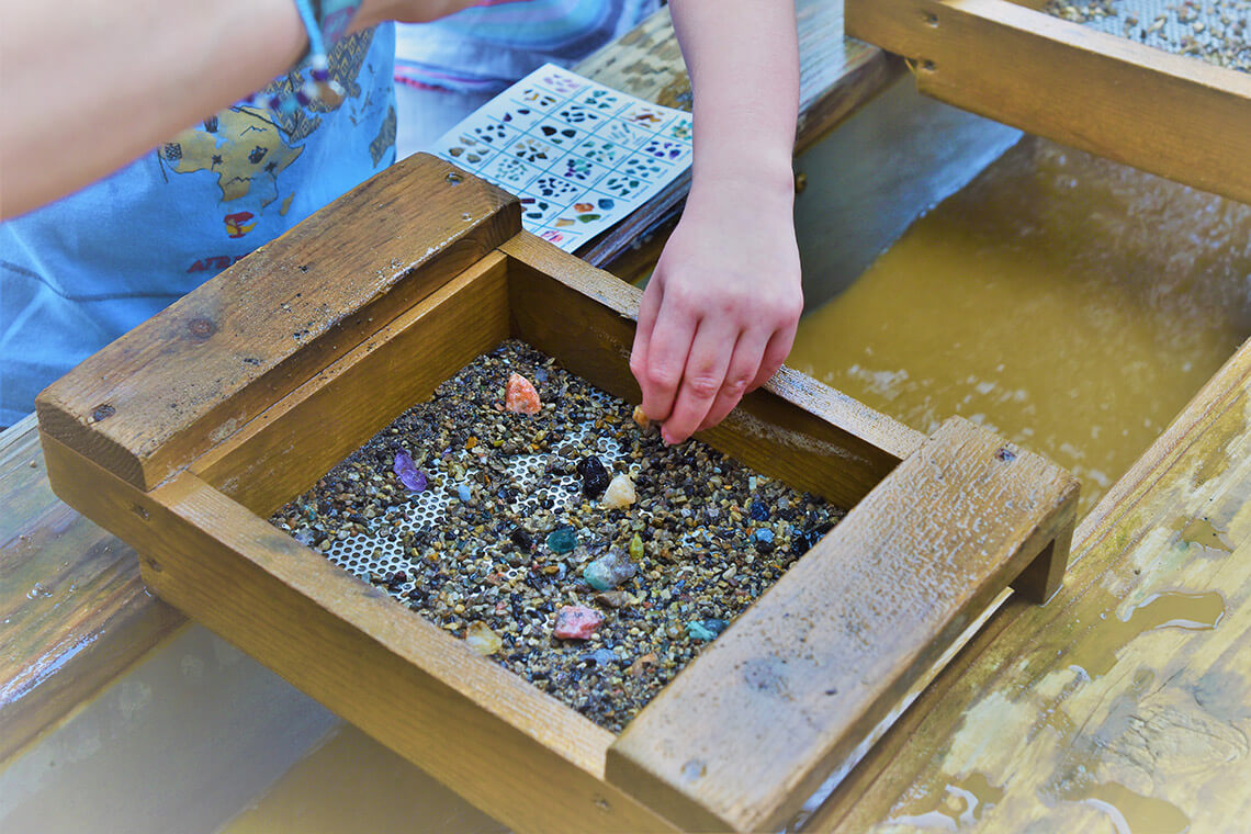 Hands panning for treasure
