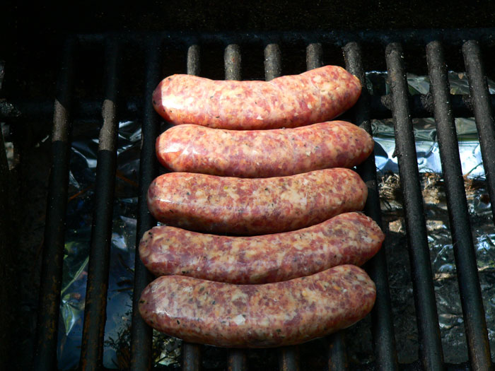 cooking sausage on the grill
