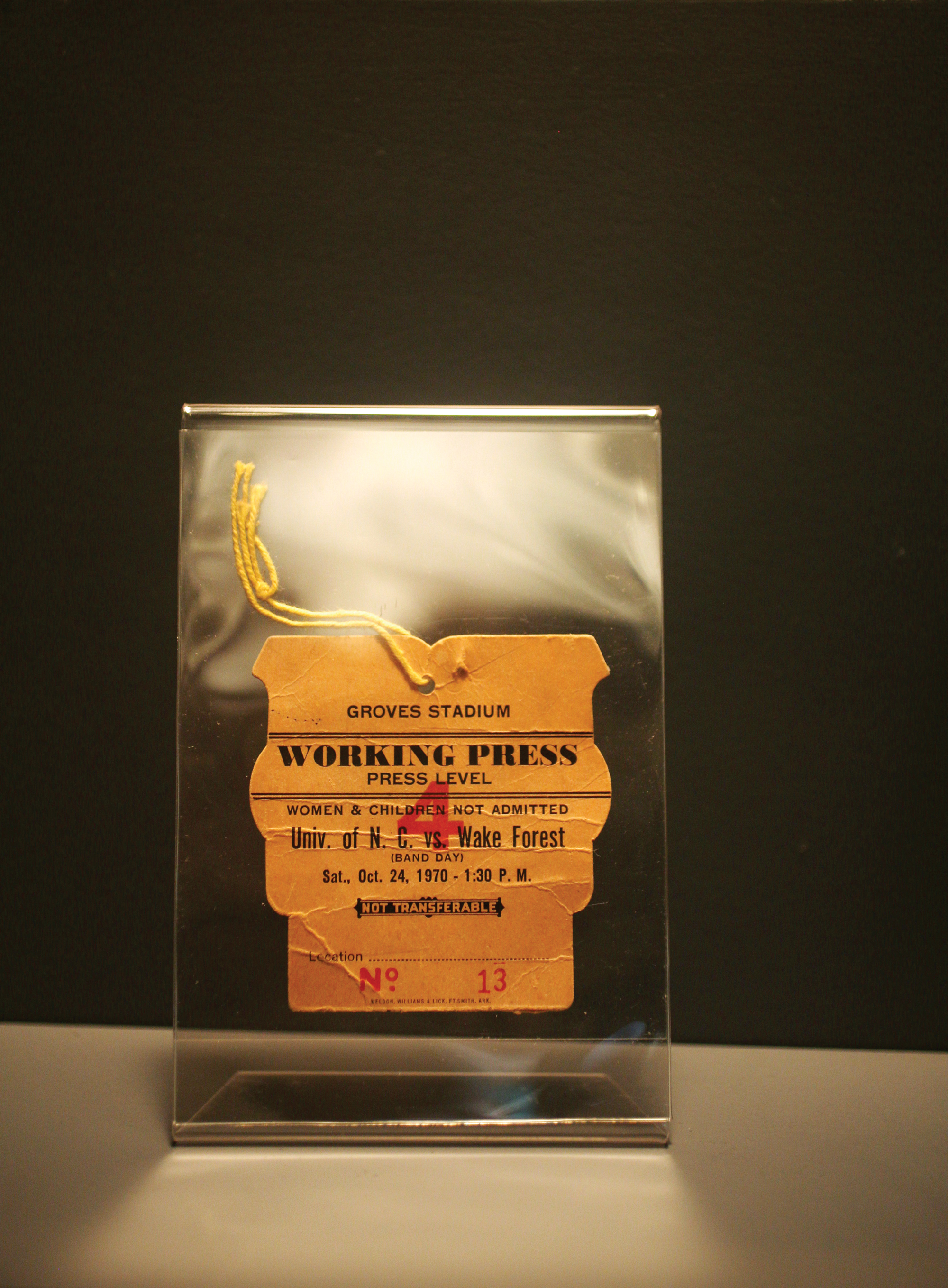 Mary Garber's press badge from 1970 reads, "women & children not admitted". 