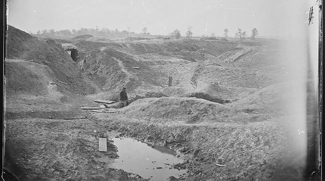 After the gunpowder-filled mine is detonated, the Confederate breastworks are unrecognizable. All that remains are a crater and stories of savage violence. • Image courtesy of National Archives.