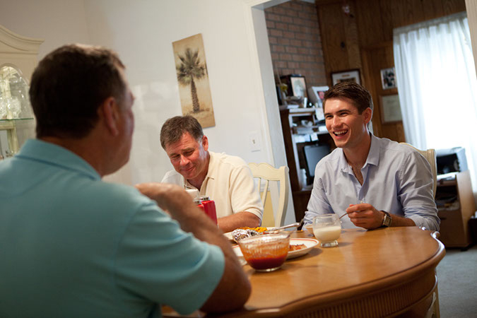 Sam Ott and his CPL family, Doug and Sue Arden, share one of their many pre game meals around the Ardens' dinner table in Newport. 