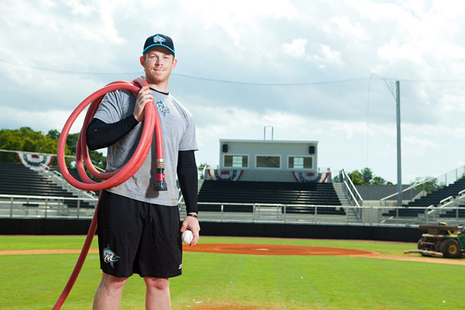 The Marlin's owner, Buddy Bengel, gets the field ready for play. 