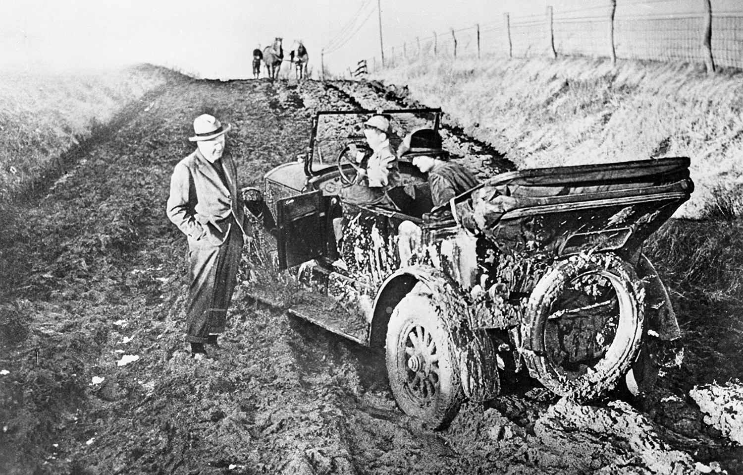 Before the Good Roads campaign, joyrides in North Carolina were more like misery rides, especially if you got stuck in the mud, like this family did in Johnston County in 1909. • Image courtesy of the State Archives of North Carolina. 