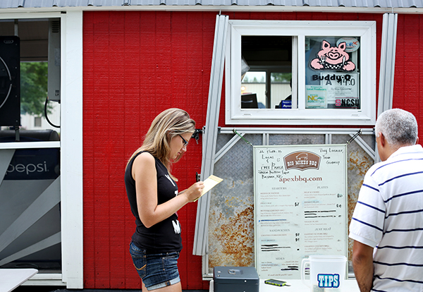 If you're craving Big Mike's barbecue, you need to know his schedule. He doesn't just drive around, loudspeaker blaring to announce his arrival like an ice cream truck. He parks at office buildings, festivals, and food truck rodeos, where Christine Farrell jots down orders. Check social media outlets like Facebook and Twitter for updates about where to find Big Mike in the Triangle area. 