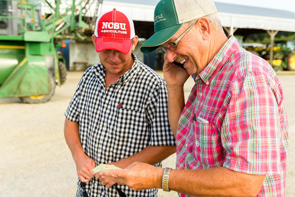 Jared Penny helps his father, Andy, farm tobacco in Johnston County.