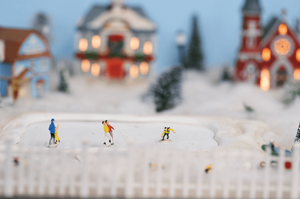 Ice skaters cruise magically (OK, magnetically) across a winter-wonderland Christmas scene complete with lit churches and decorated homes.