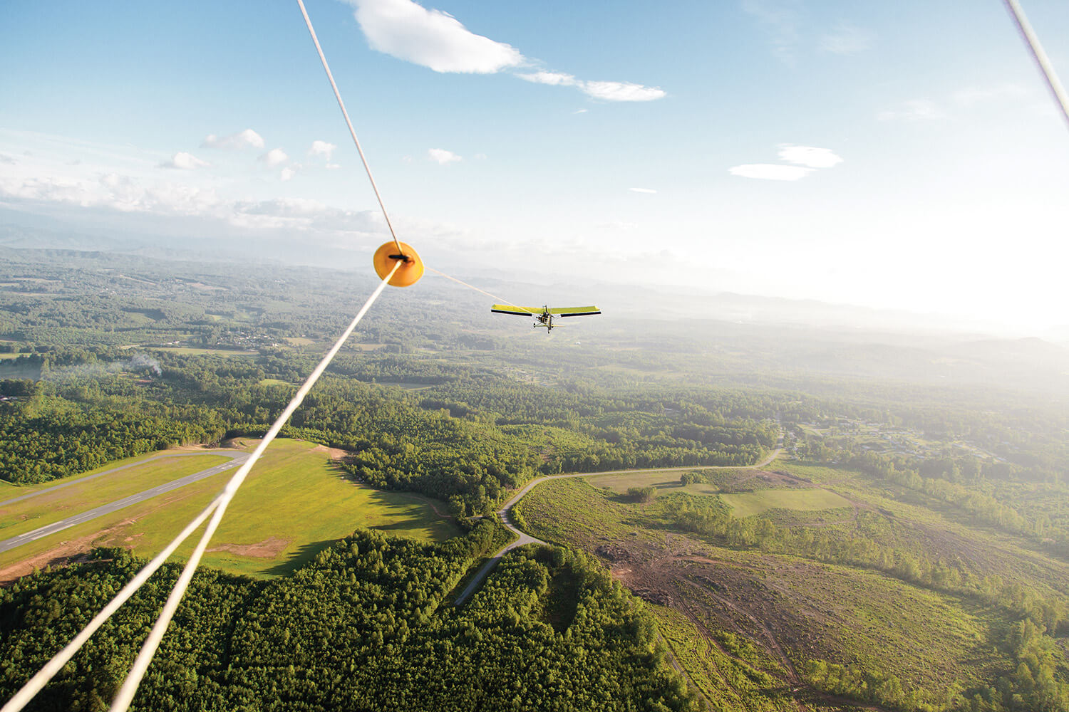 A lightplane pulls the hang glider to the proper altitude. When the line is detached, it’s just the wind, and you.