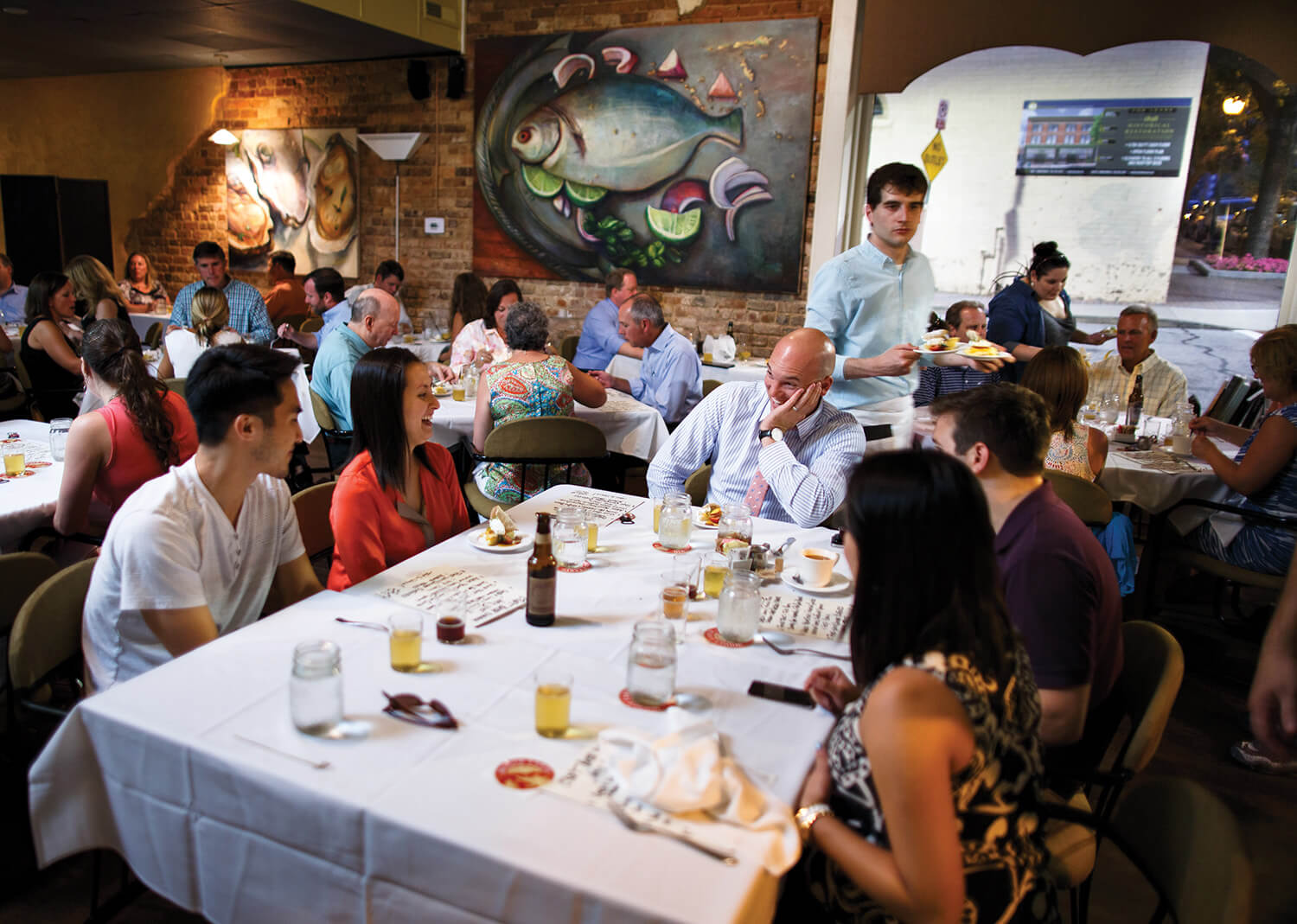 Big art, beer tasting, and a full house at Table 16 on a Thursday night.