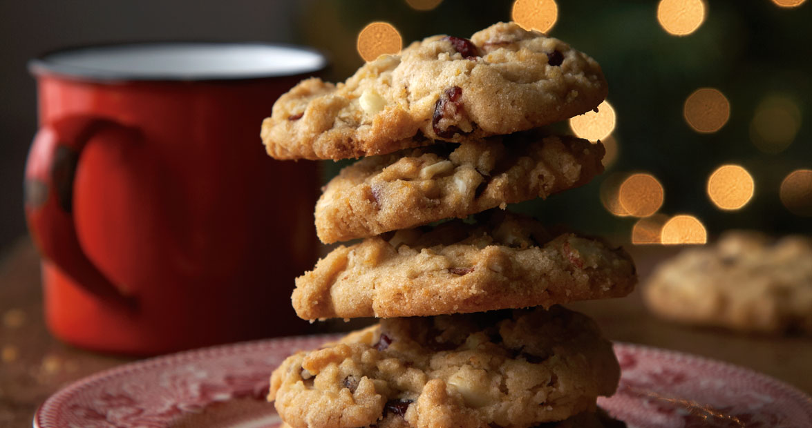 Stack of white chocolate chip cookies for Our State's Christmas cookies.