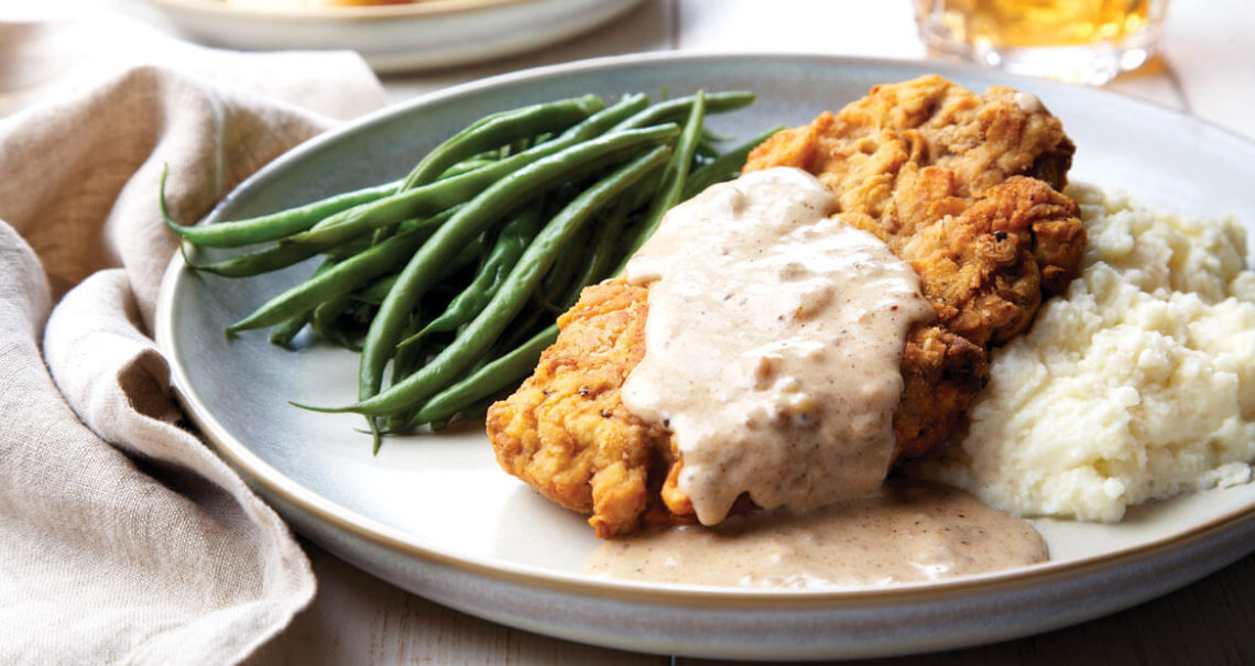 Smothered fried pork chop and gravy