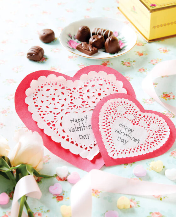 Valentine's Day heart shaped cards with candy and sweets.