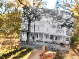 And old black and white photo of Latta University held in front of the original location.