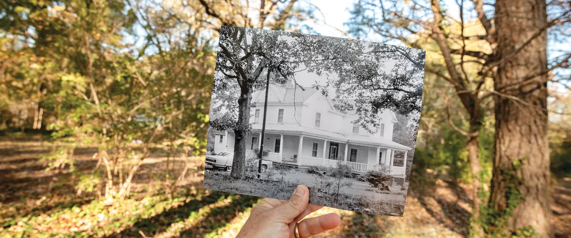 And old black and white photo of Latta University held in front of the original location.