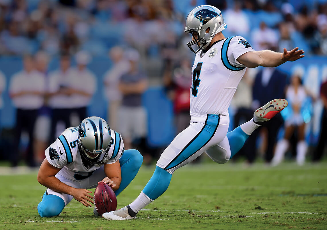 Carolina Panthers kicker Joey Slye goes for a punt.