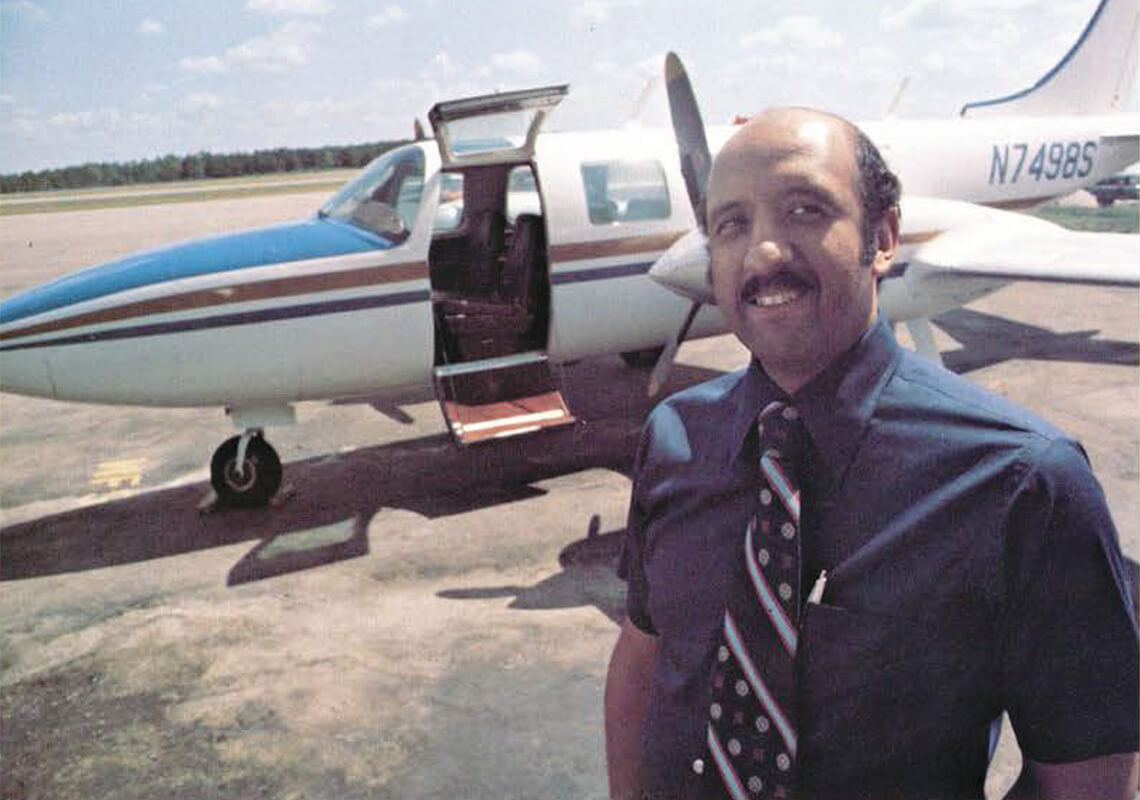 Warren Wheeler stands in front of one of his own plants in 1977.
