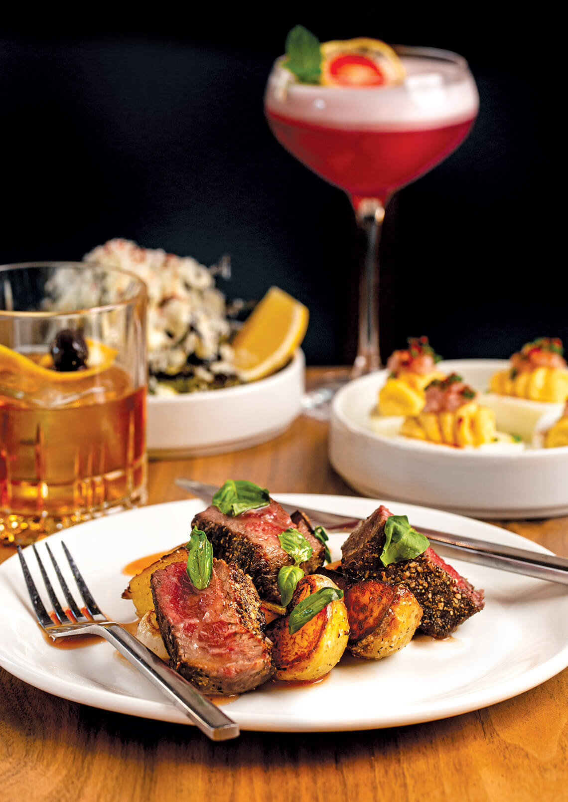 Dinner plate with Wagyu steak, potatoes and pear onions.