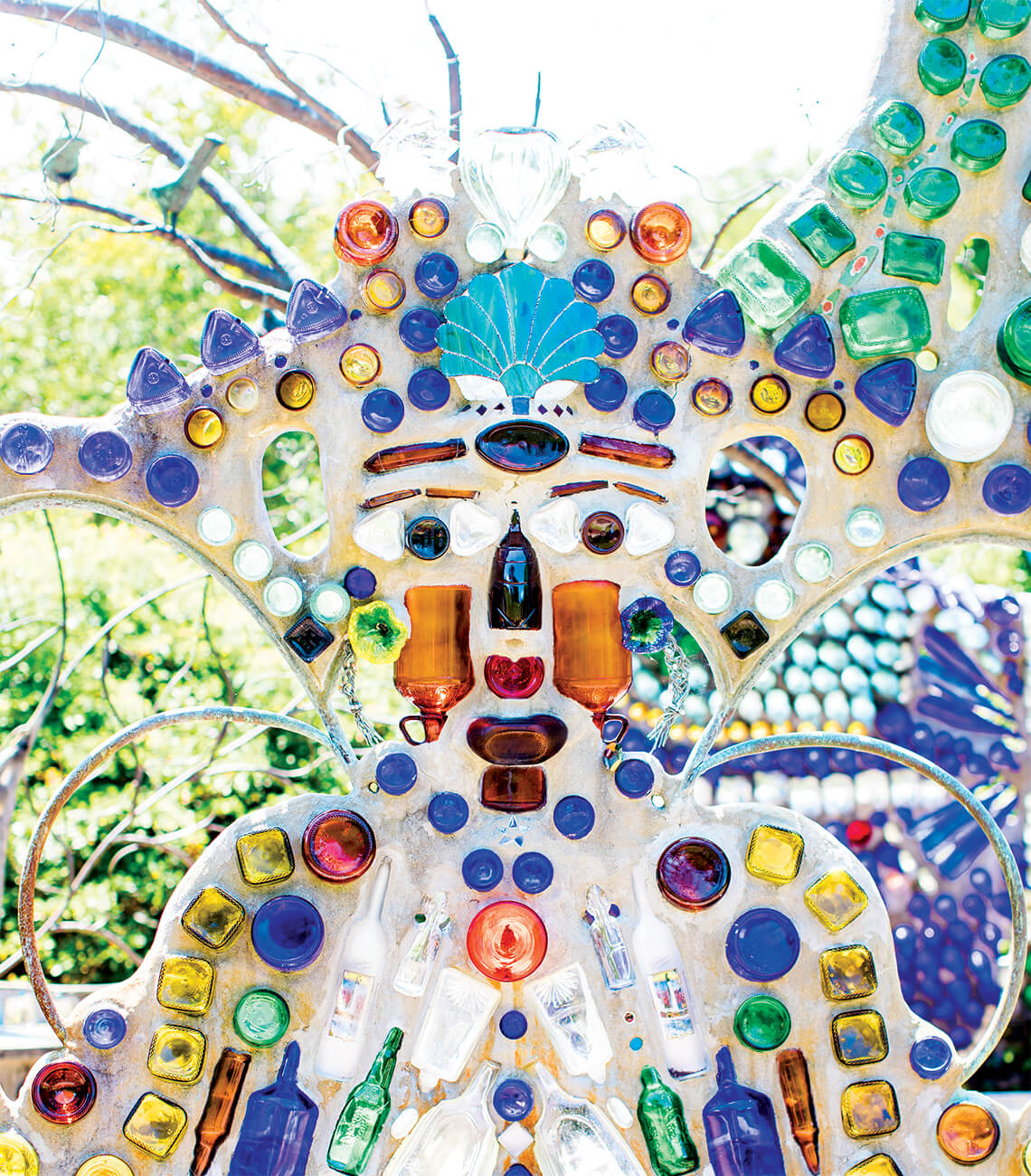 Close-up photograph of a glass bottle figure in a wall.