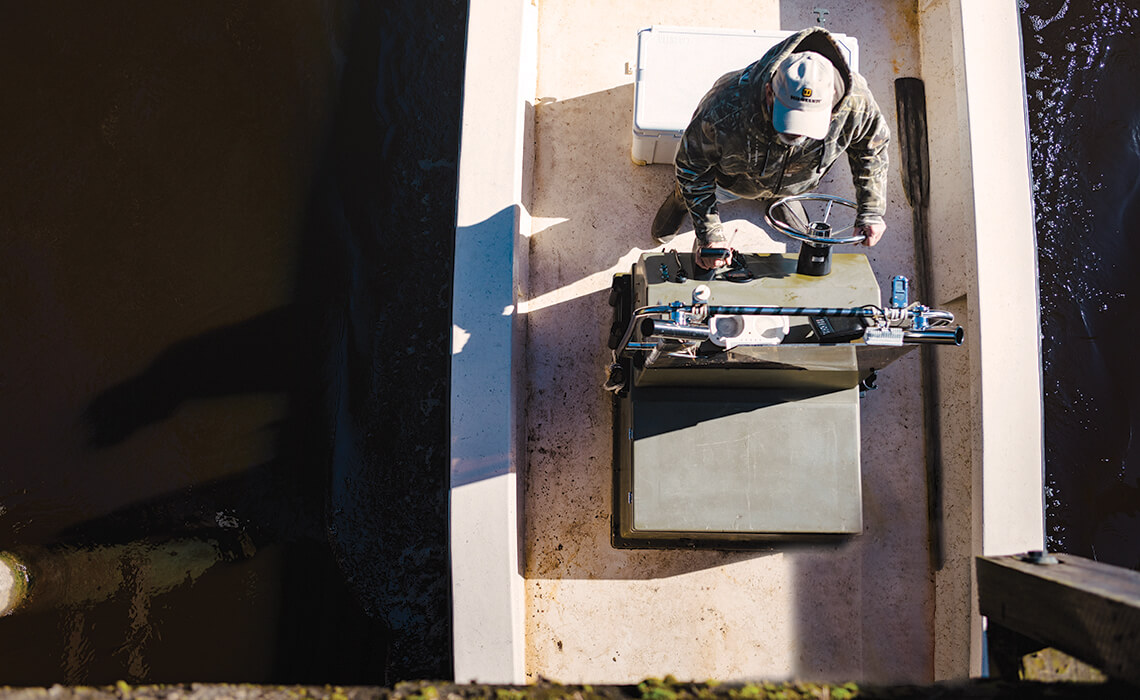 Johnny Dickinson boats under a bridge.