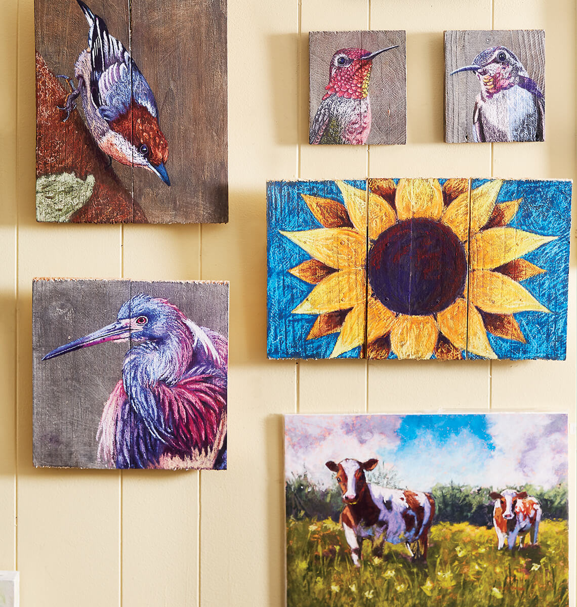 Various paintings on a wall.