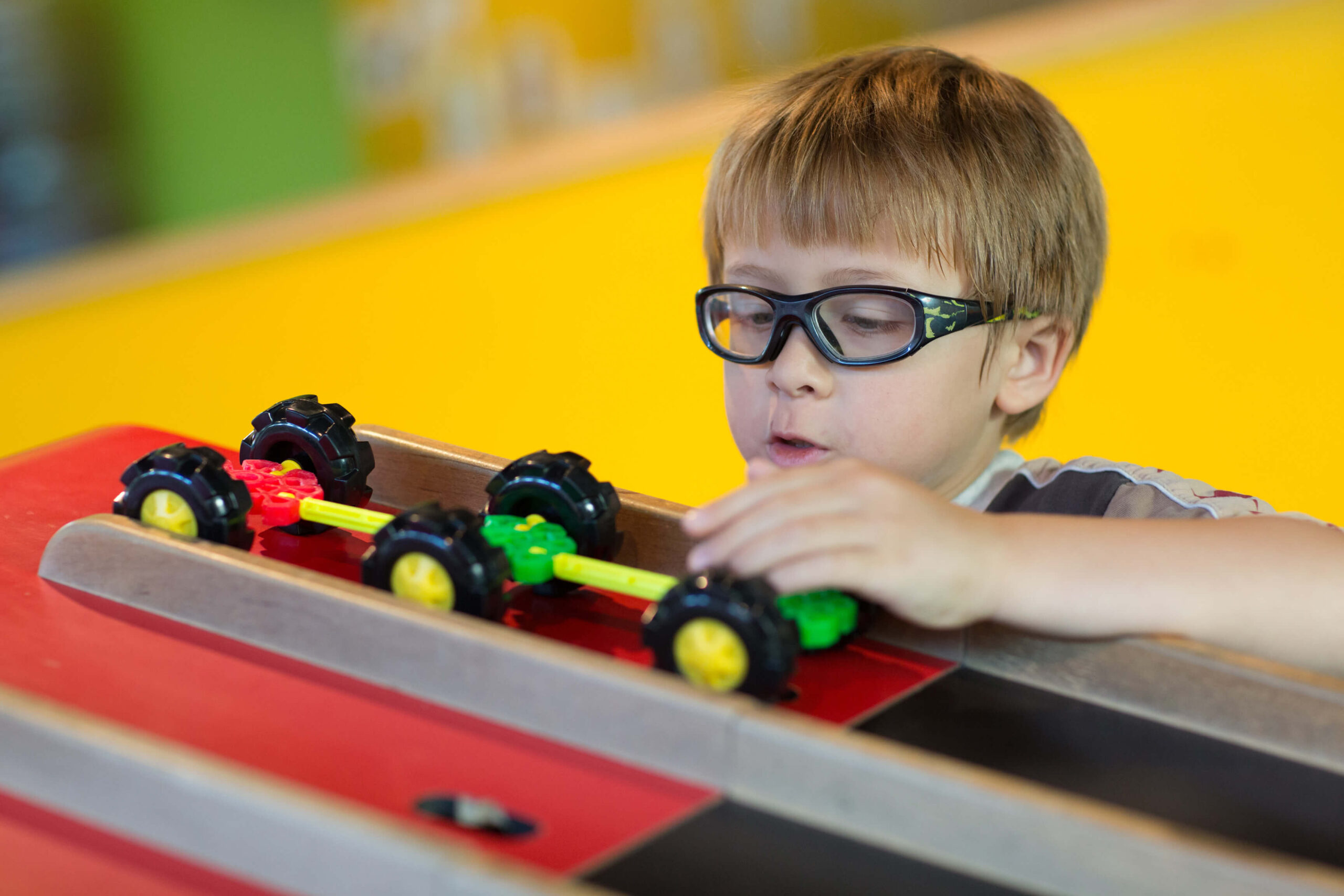 Child playing with toys at the Marbles Kids Museum