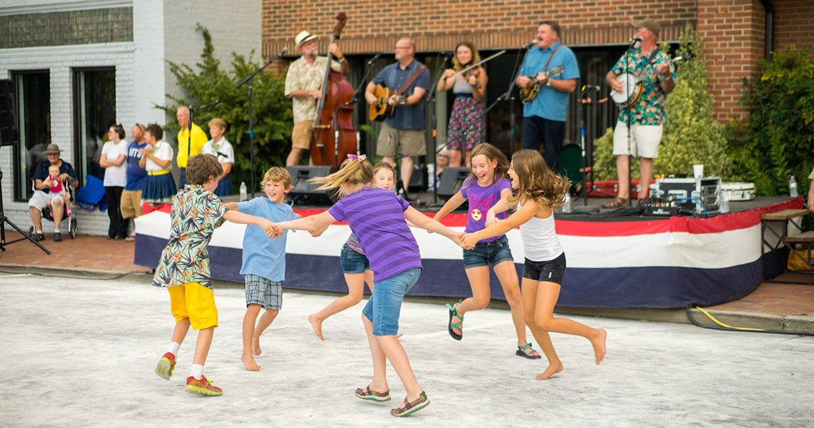 Children dancing at street music festival in Waynesville