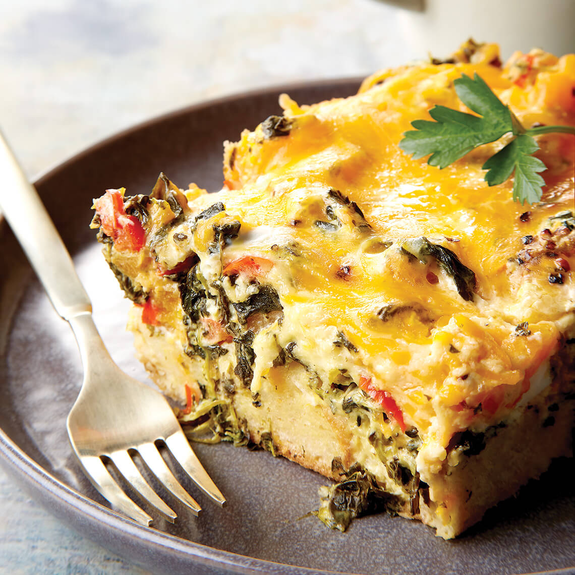 Slice of vegetable strata on a plate