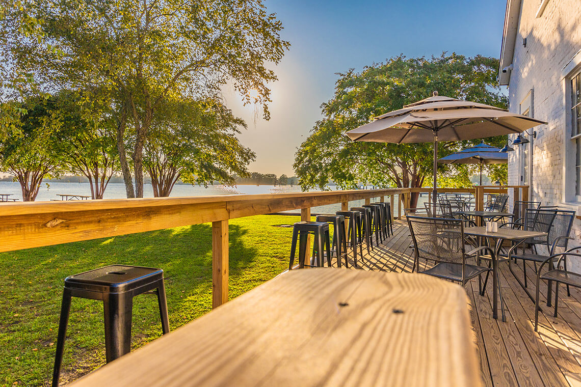 Outdoor tables and chairs at the Herringbone on the Waterfront in Edenton, NC.