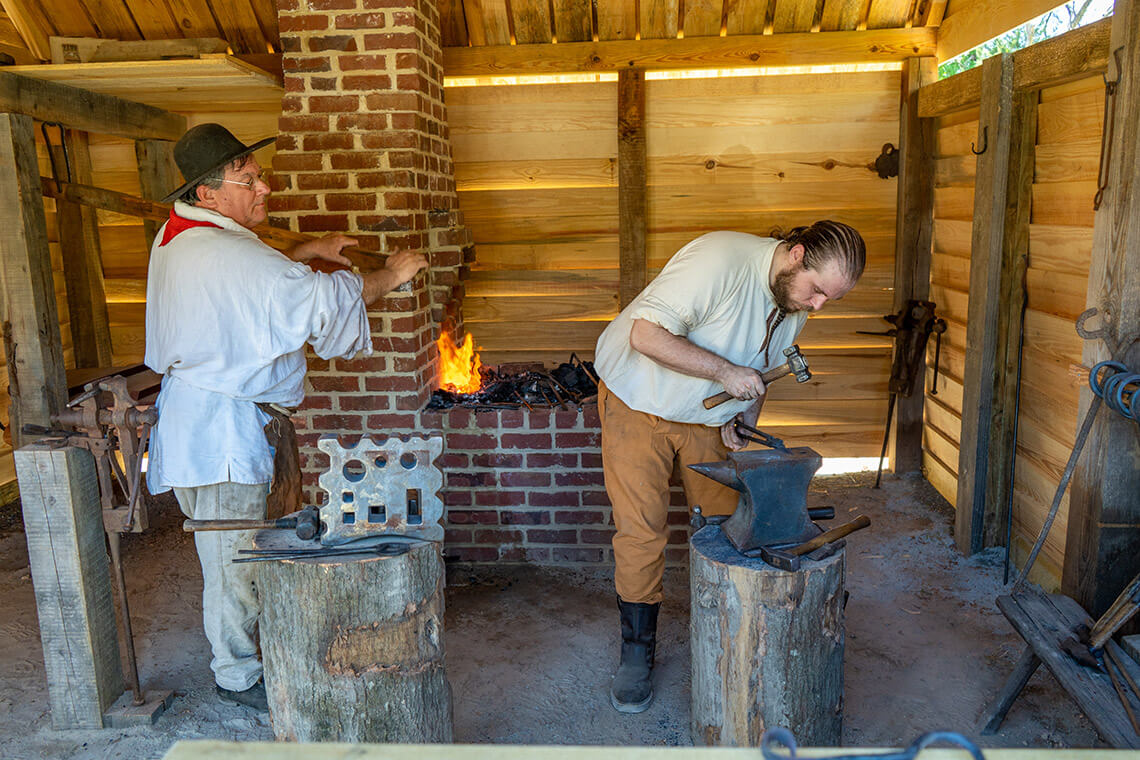 Blacksmiths in the Bradford-Denton forge.