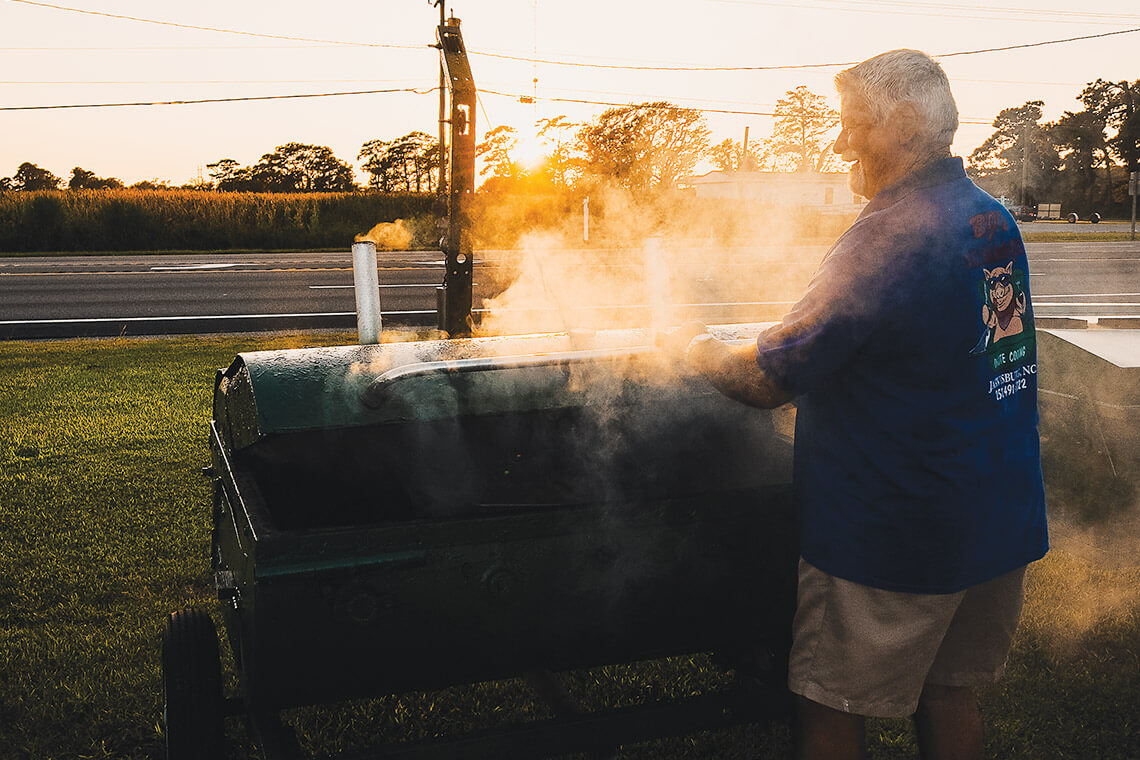 BJ Beasley mans the smoker outside of BJ's Carolina Cafe.