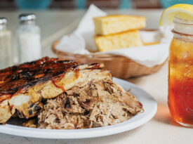 A plate of ribs and pulled pork barbecue with iced tea at BJ's Carolina Cafe.