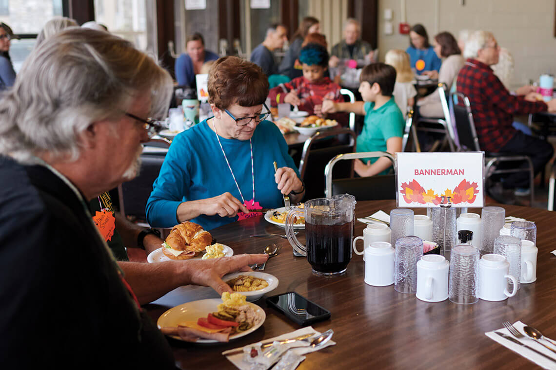 Campers sit down to buffet-style meals at Bannerman Folk Camp.