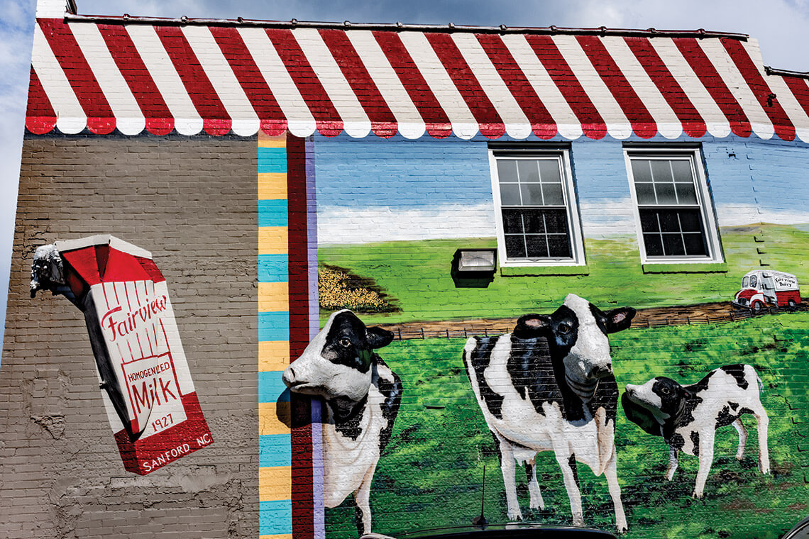 Mural in downtown Sanford of Fairview dairy cows.