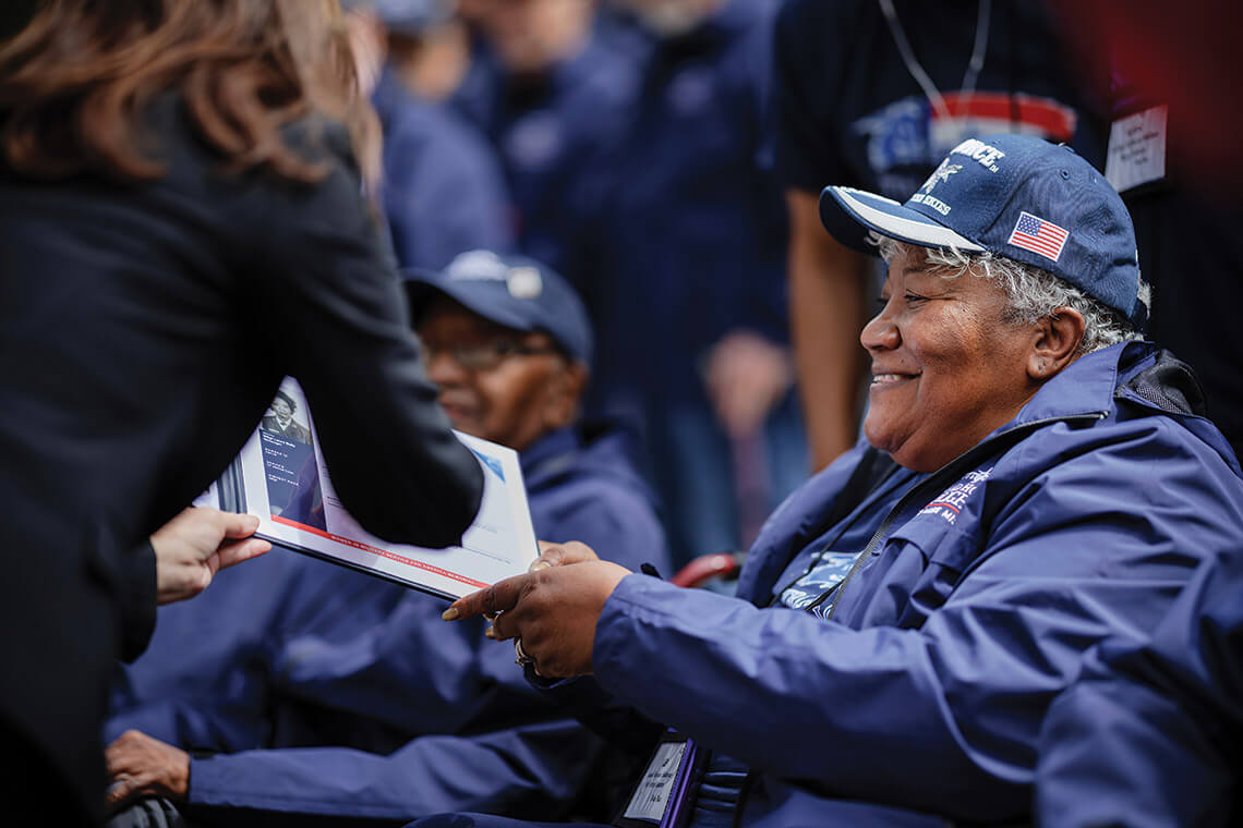 Laura Bellanger is presented with commemorative honors at the Triad Honor Flight