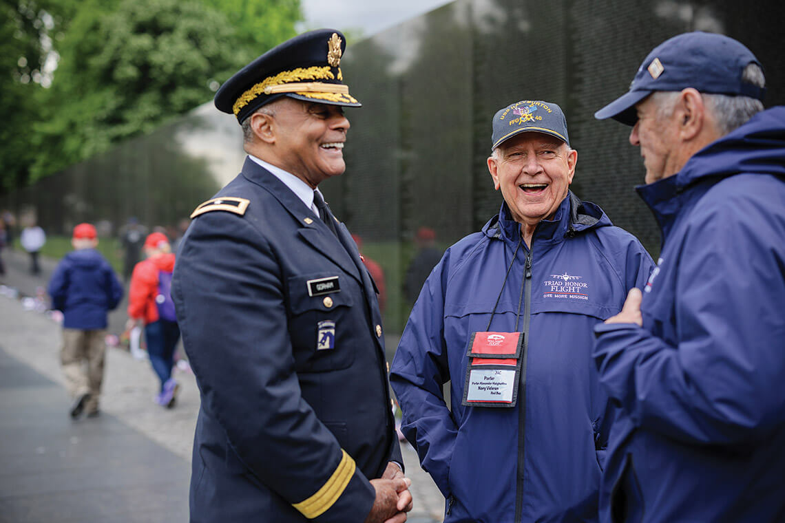 At the Vietnam Veterans Memorial, James R. Gorham (left), the first Black brigadier general of the North Carolina National Guard, and former P.O.W. Porter Halyburton, and a fellow vet.