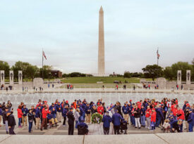 Triad Honor Flight attendees stand at the National Mall