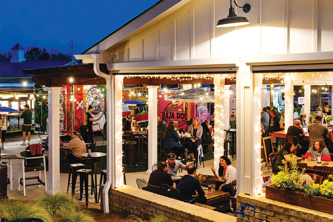 Patrons gather at Red's Corner and Carolina Cottage.