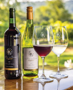 2 bottles and 2 glasses of Souther Williams Vineyard's North Carolina wine.