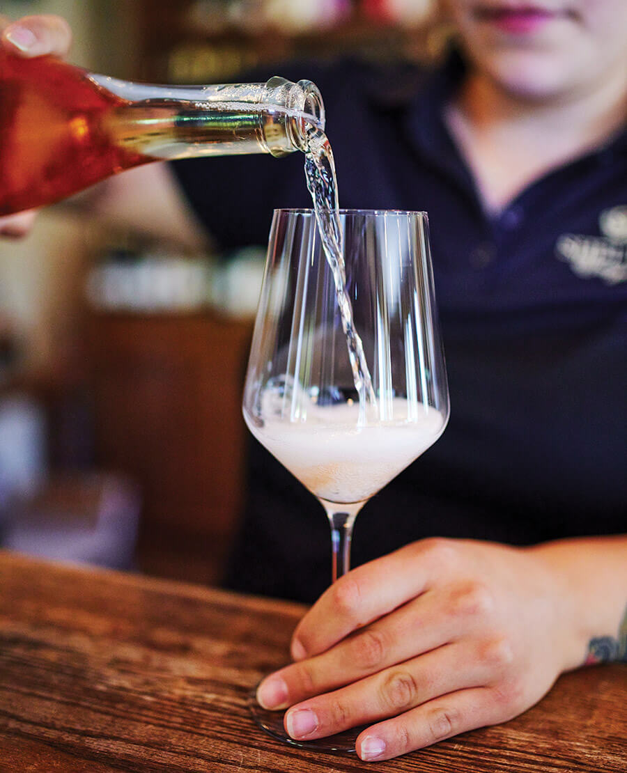 Pouring wine at Shelton Vineyards, one of the North Carolina wineries.