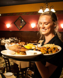 Server carries tray at Kimber's Steakhouse