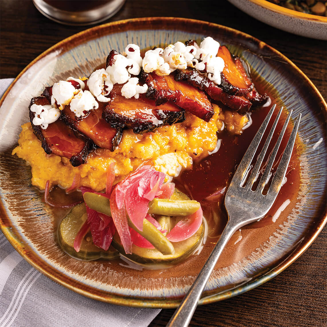 Pork belly over grits from Birchwood Hall Southern Kitchen.