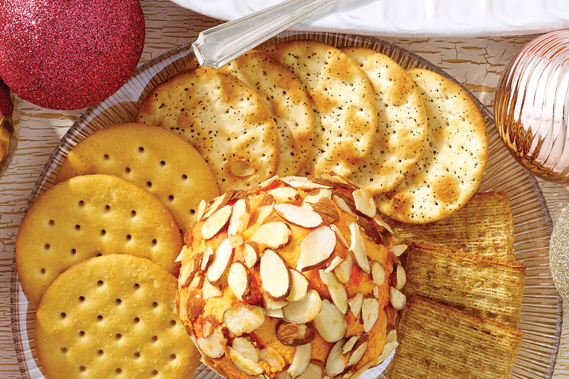 Cheese ball on a plate with crackers