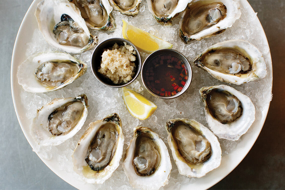Plate of raw oysters on the half shell at Postal Fish Company