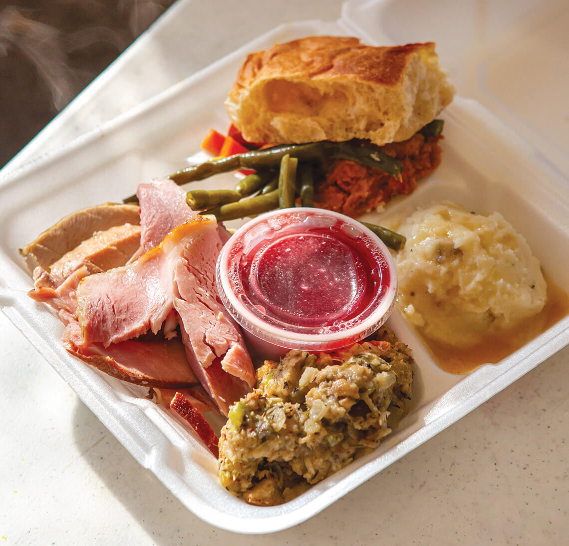 A takeout box of Christmas ham and all the fixins' from the Bounty of Bethlehem