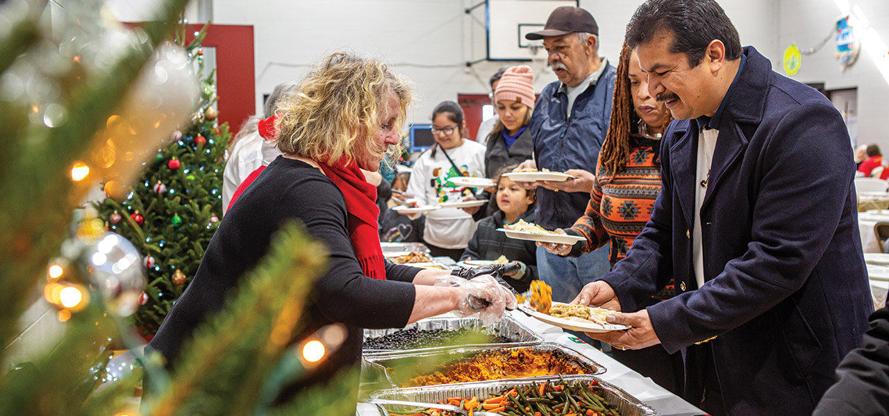 Volunteers and community members come together at the Bounty of Bethlehem buffet