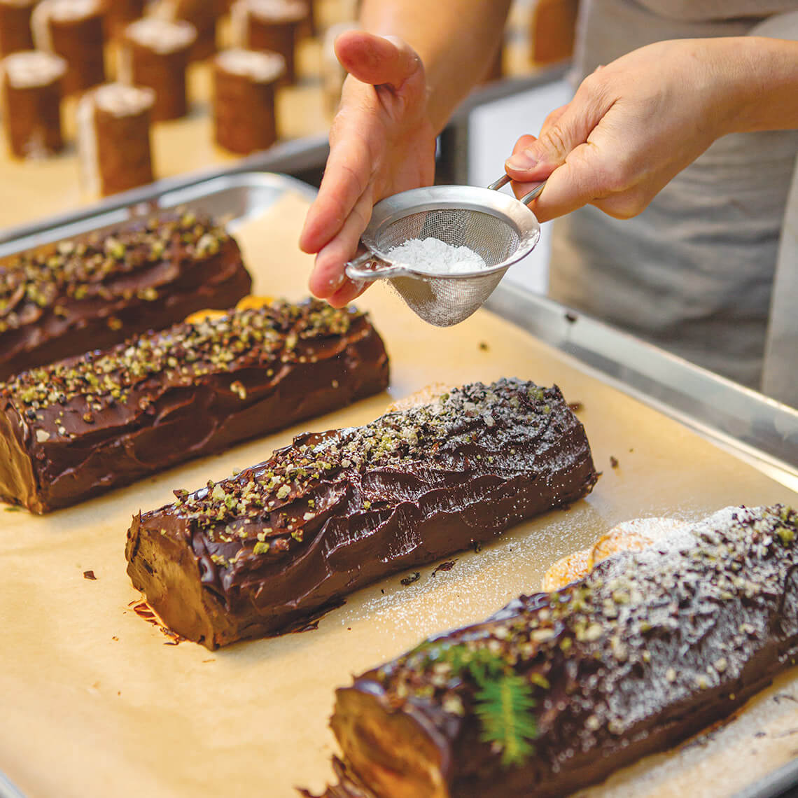 Buche de noels or Yule logs at OWL Bakery, dusted with powdered sugar. 