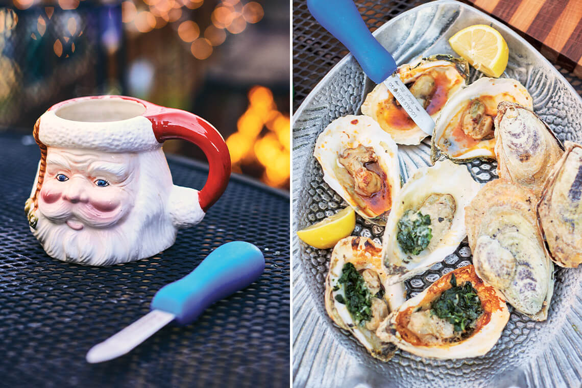 Oyster shucker next to a Santa-shaped coffee mug and platter of roasted oysters