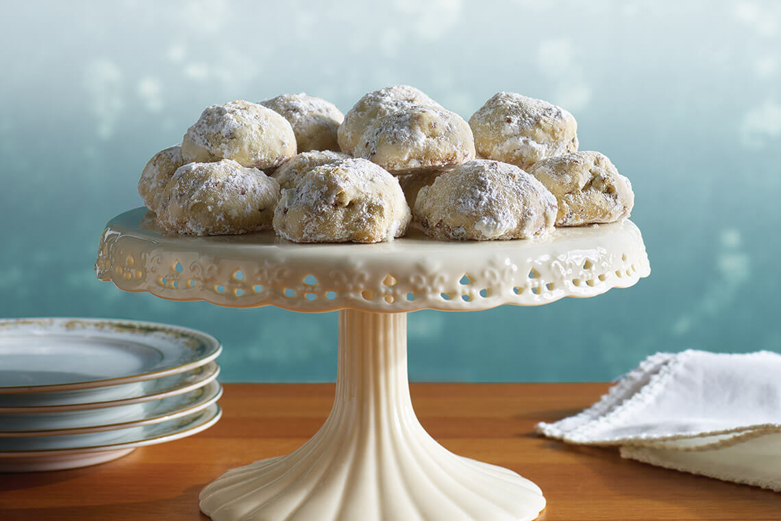 Cake stand topped with pecan puffs