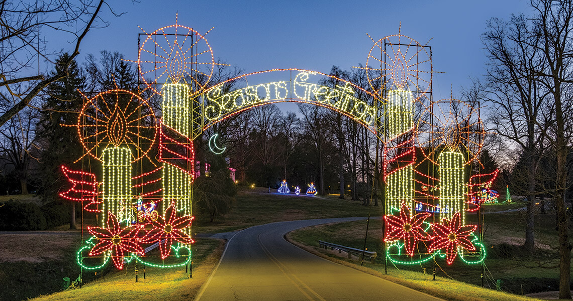 Seasonings Greetings illuminated entryway at Tanglewood Park Festival of Lights