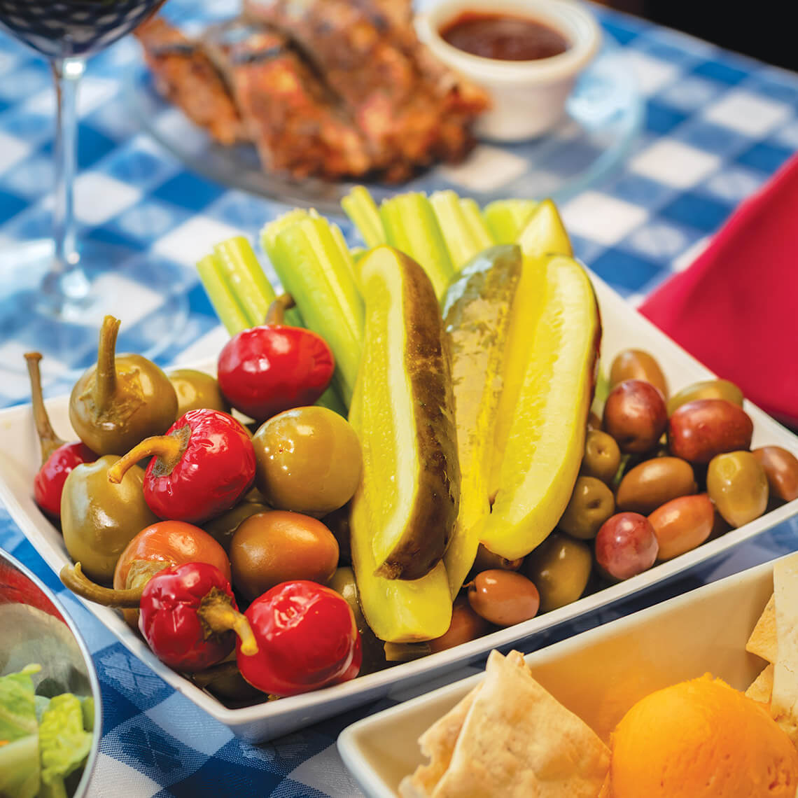 Angus Barn relish tray with pickles, sweet peppers, olives, and celery